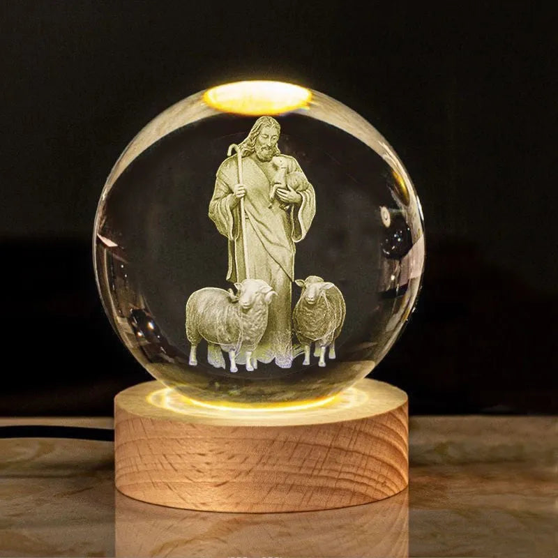 White crystal ball with cross and religious symbols on wooden LED base desk ornament
