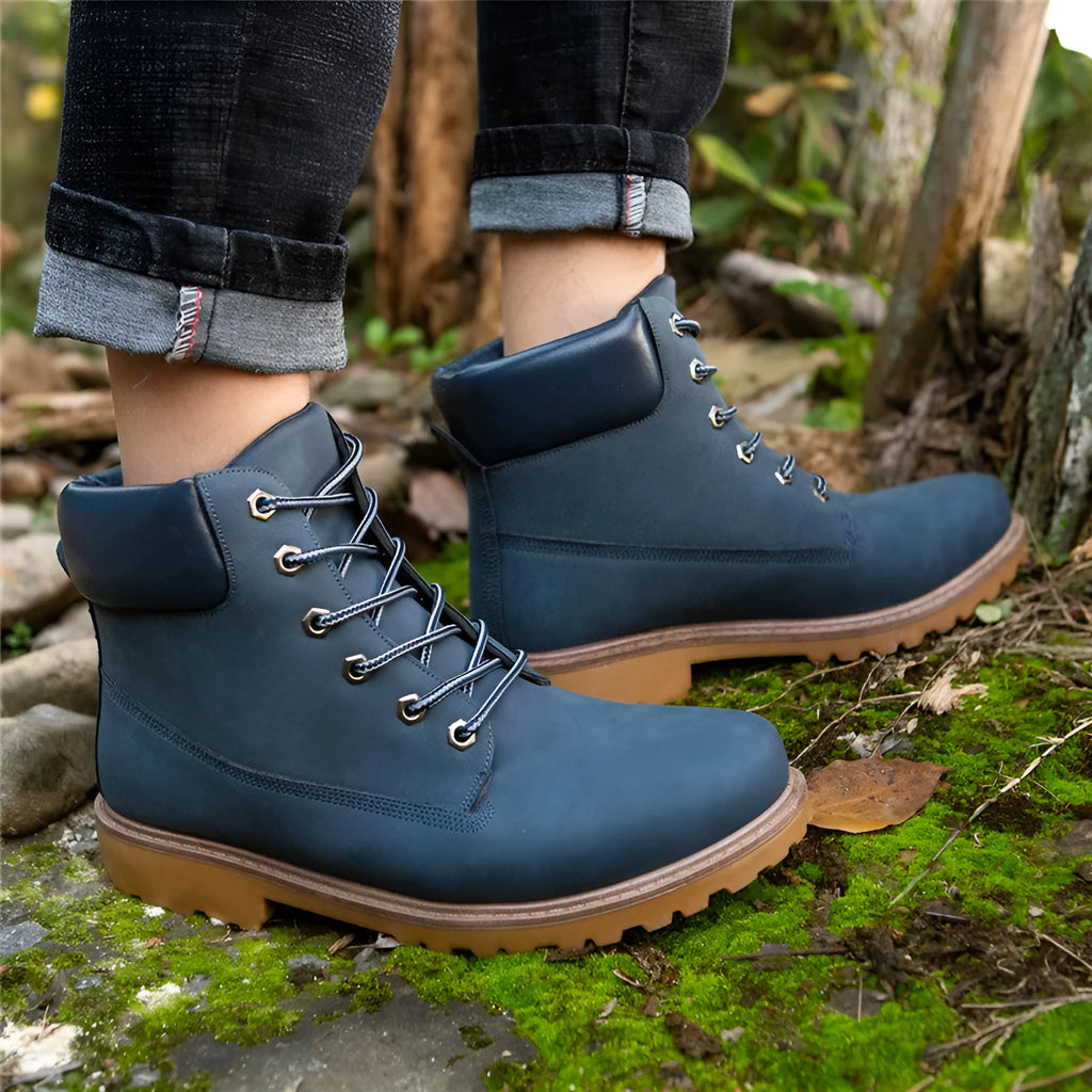 Men's pink Martin ankle boots with velvet lining, round toe, flat sole, and front lace-up closure.