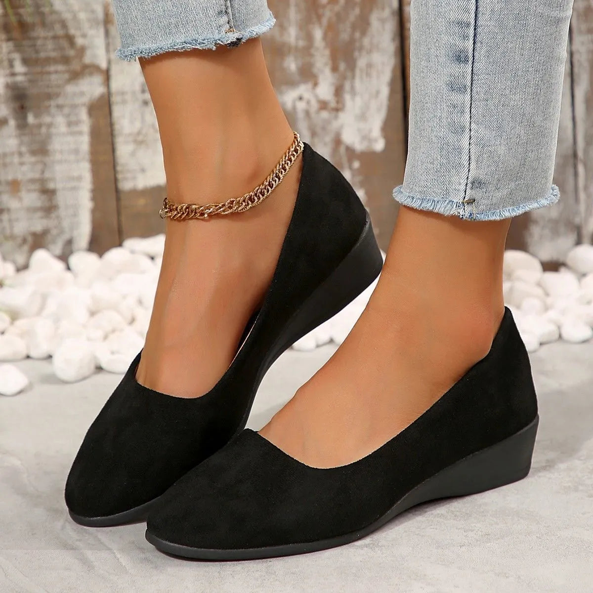 Women's pointed toe suede wedge pumps in light brown with a shallow mouth cut and low rubber sole.