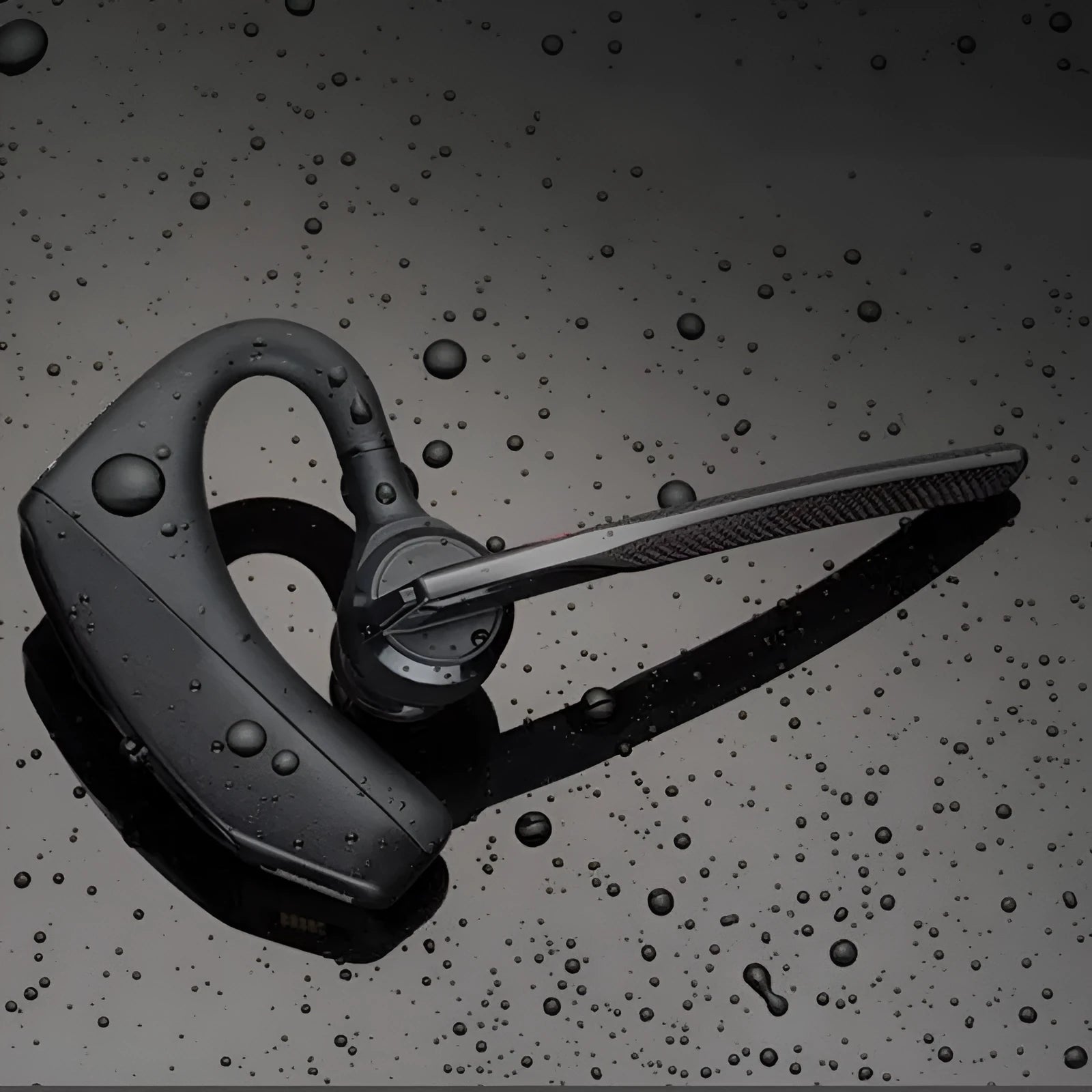 Black over-ear Bluetooth sports headphones with a large battery, shown on a model or display