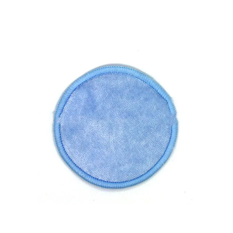 Set of eight pink and blue velvet makeup remover pads next to an organic cotton mesh drawstring bag.