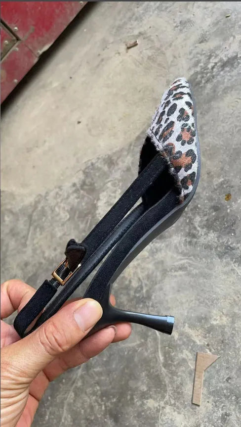 Women's leopard print suede sandals with pointed toe and high heel design on white background