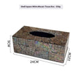 Black rectangular natural shell tissue box storage container with removable insert on a table.