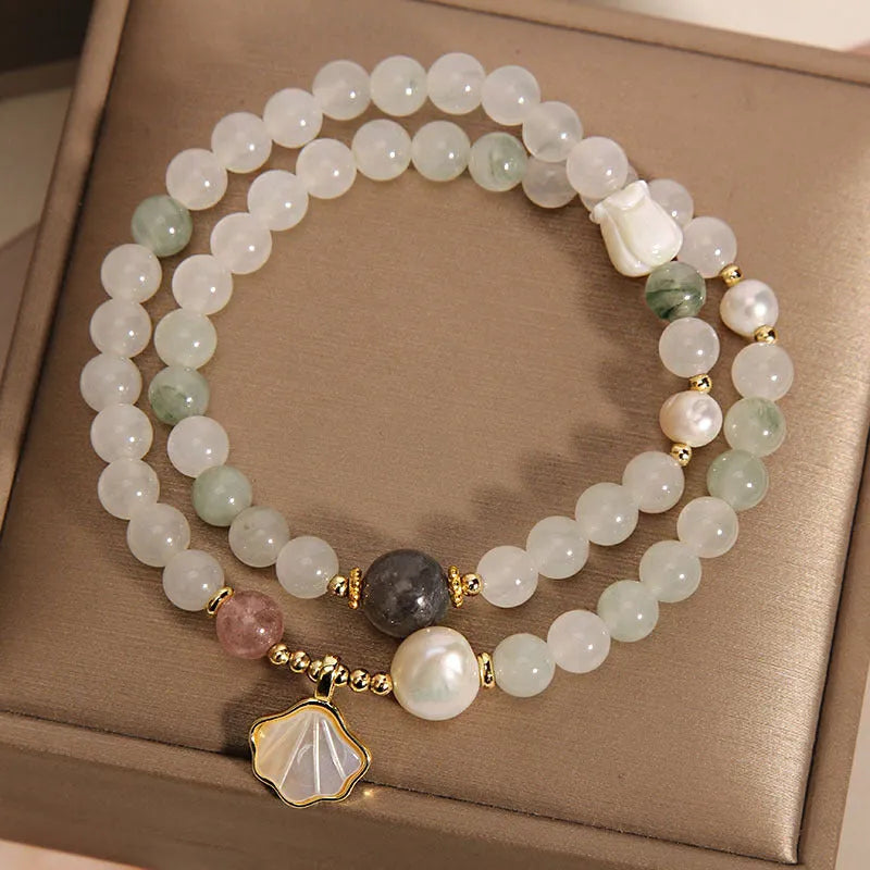 Women's crystal bracelet with an apricot leaf pendant and gold-plated gemstone accents in a green Tianshan jade colour.