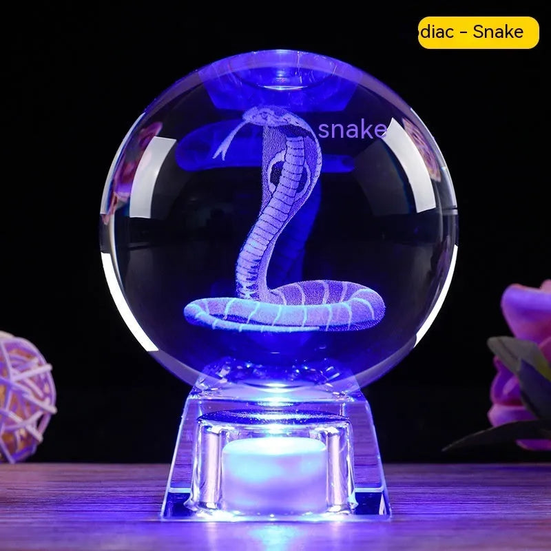 Chinese zodiac crystal ball lamp with electronic charging base showing animal design