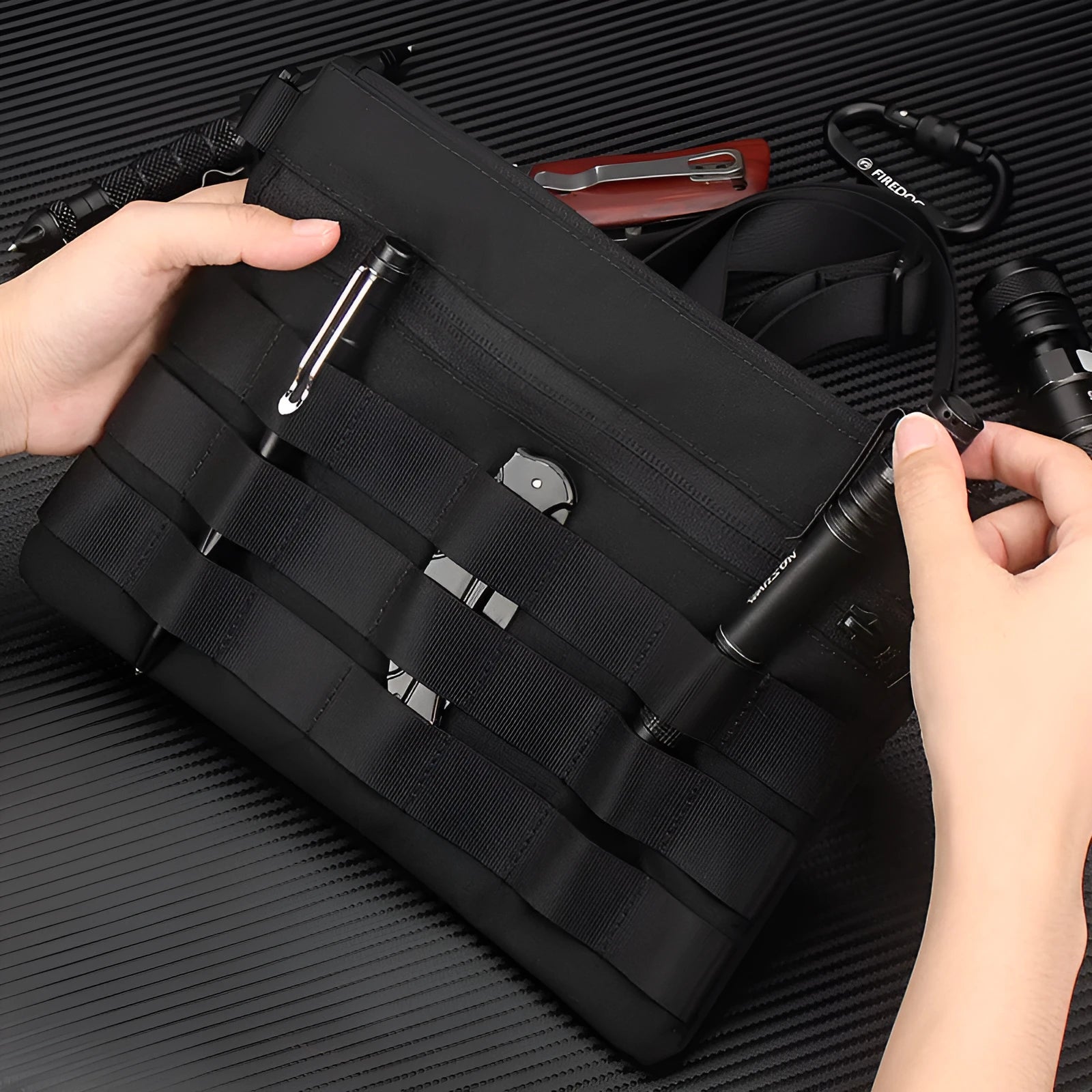 Black solid colour oxford cloth portable outdoor organiser bag with 18cm by 3.5cm dimensions.