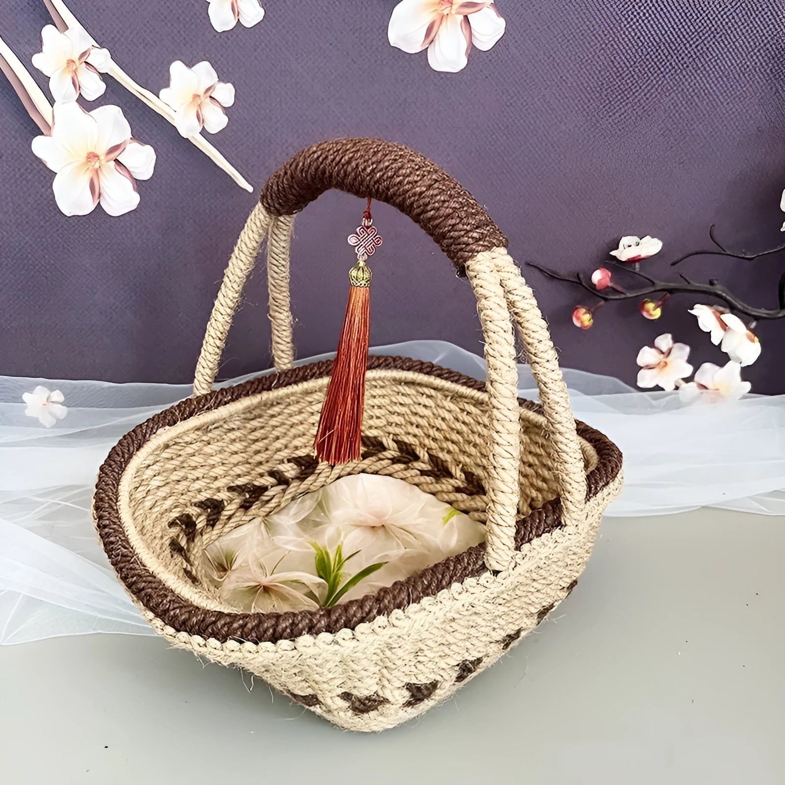Hand-woven hemp rope basket in rustic coffee brown colour, measuring 19cm by 12cm.