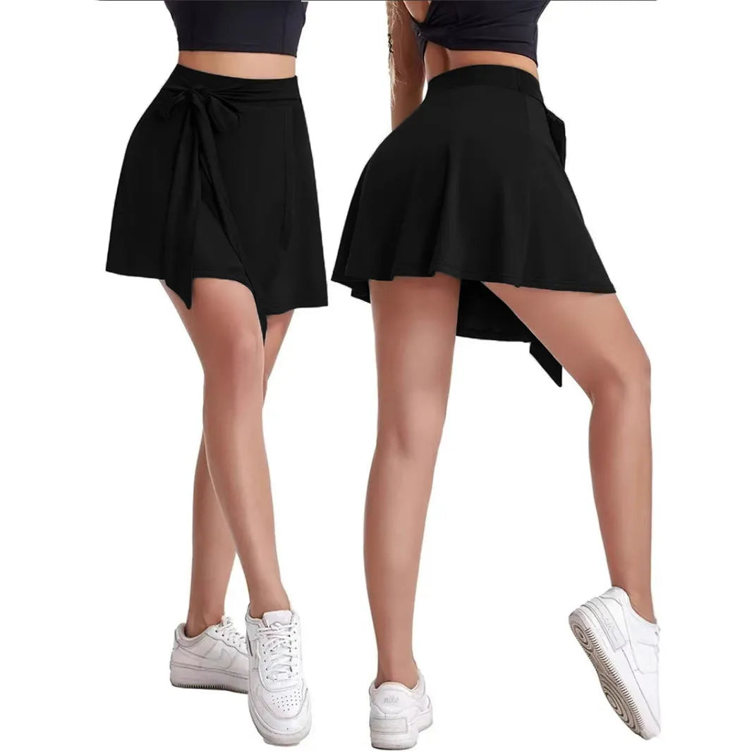 Black thigh-length unisex sports skirt with built-in shorts, high waist, and culotte style.
