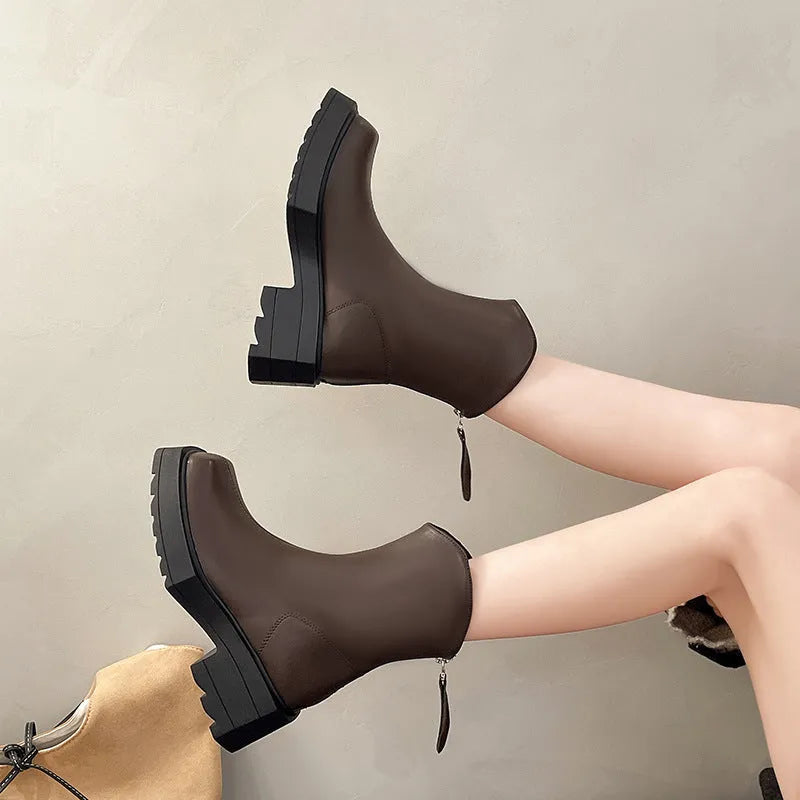 Black platform Martin boots for women with square toe, high heel, and back zipper.