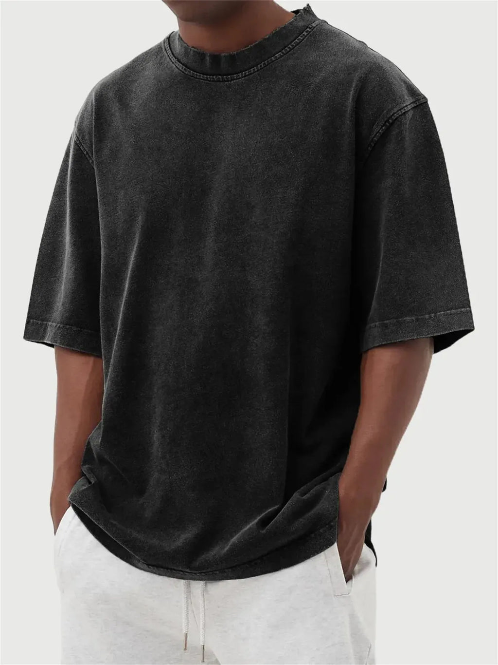 Men's washed distressed pullover t-shirt in solid colour with loose fit and stone washed finish