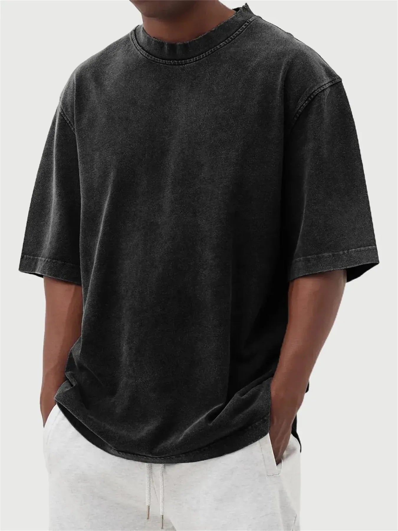 Men's washed distressed pullover t-shirt in solid colour with loose fit and stone washed finish