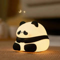 White panda-shaped night light with black accents measuring 150mm tall with USB charging port