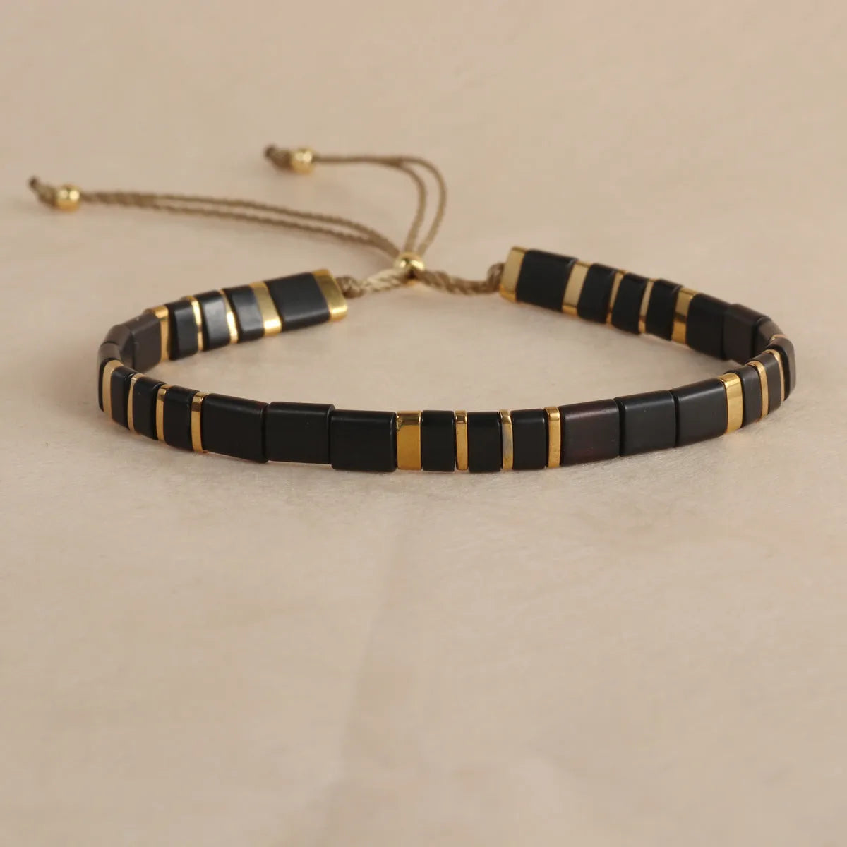 Geometric glass and coloured glaze bead bracelet in milky white, black, green, blue, or red