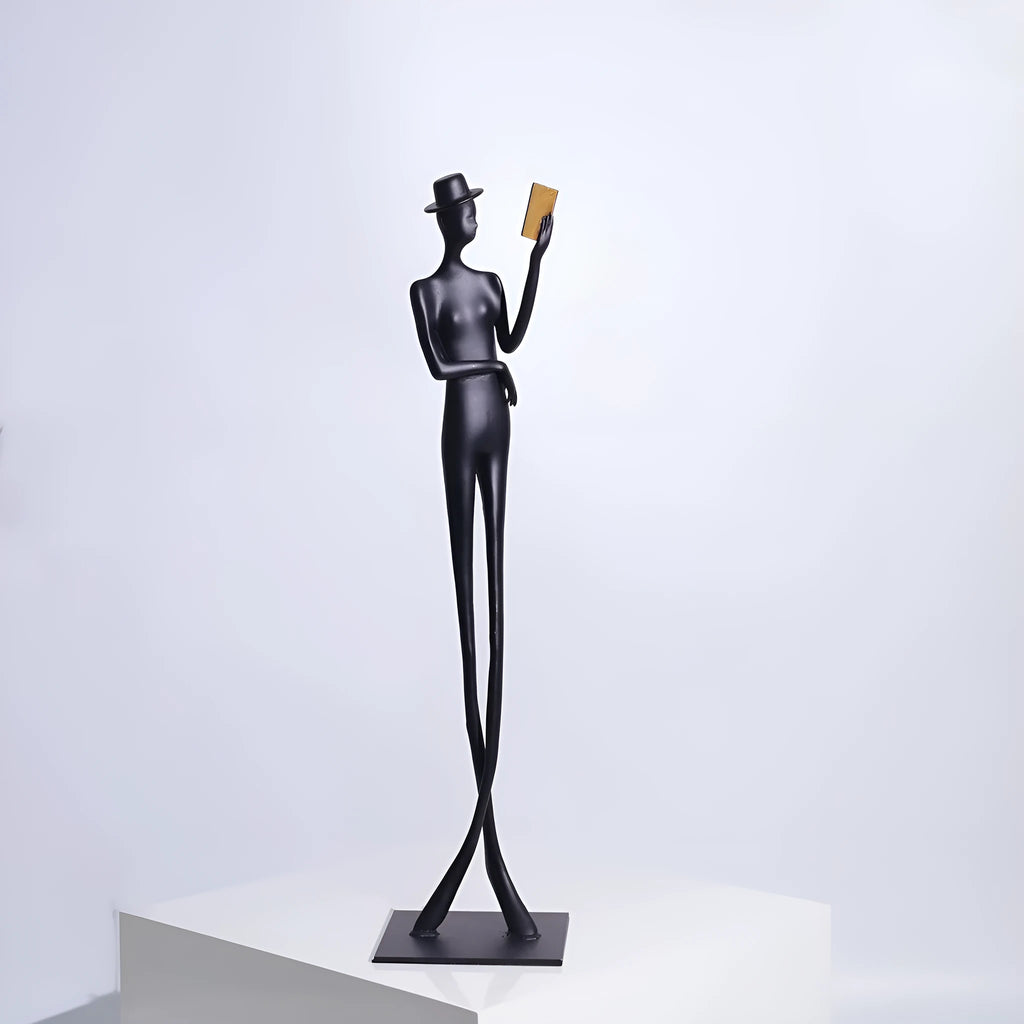 Black metal cast aluminium desktop sculpture with modern minimalist character figure design