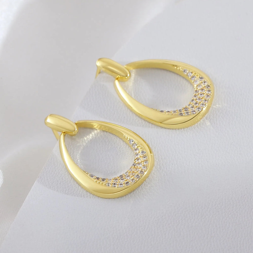 Women's yellow gold geometric drop earrings with copper electroplated finish measuring 2.6cm by 1.7cm