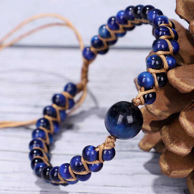 Handmade woven geometric pull bracelet in blue tigereye stone with adjustable closure.