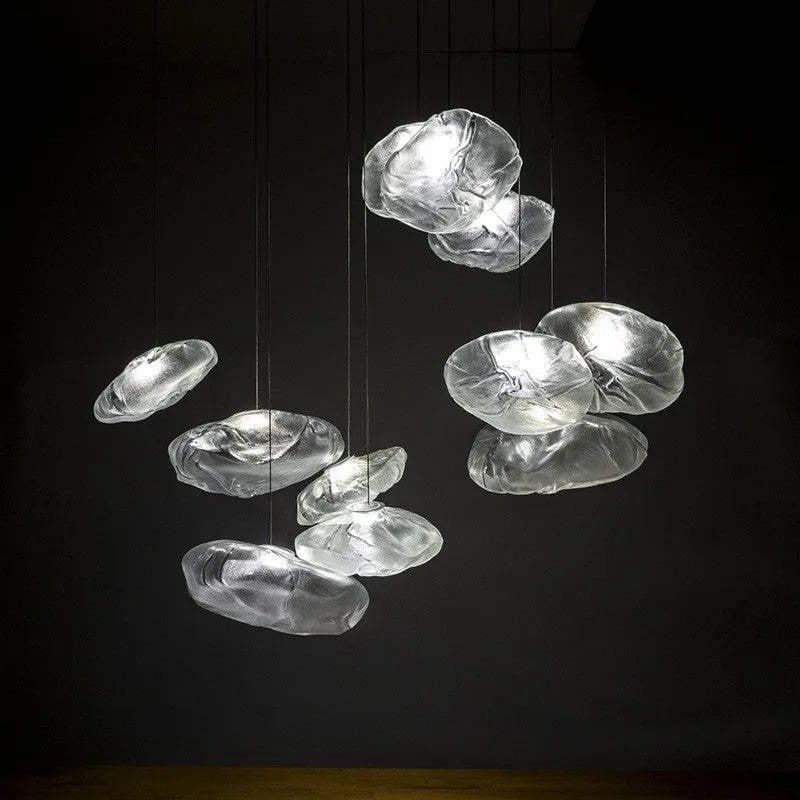 Modern fabric chandelier with glass shade shown in small and large sizes with clear, amber, and smoke grey light options.