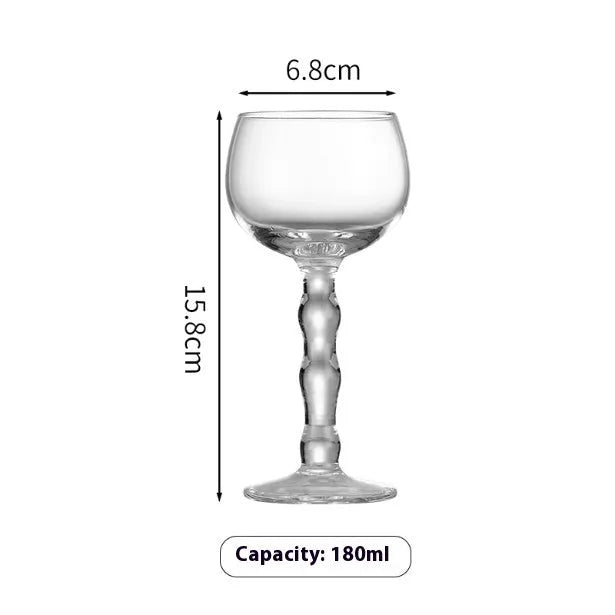 Set of six clear glass drinking vessels with different designs including beer steins and champagne glass