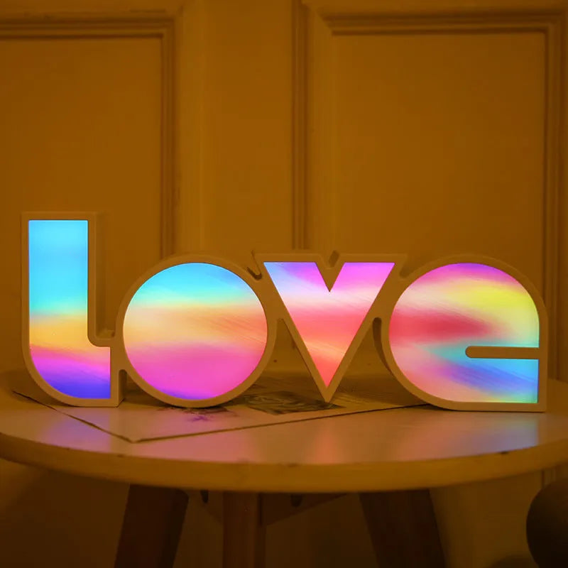 Rainbow coloured LED decorative light spelling LOVE, with USB cable.