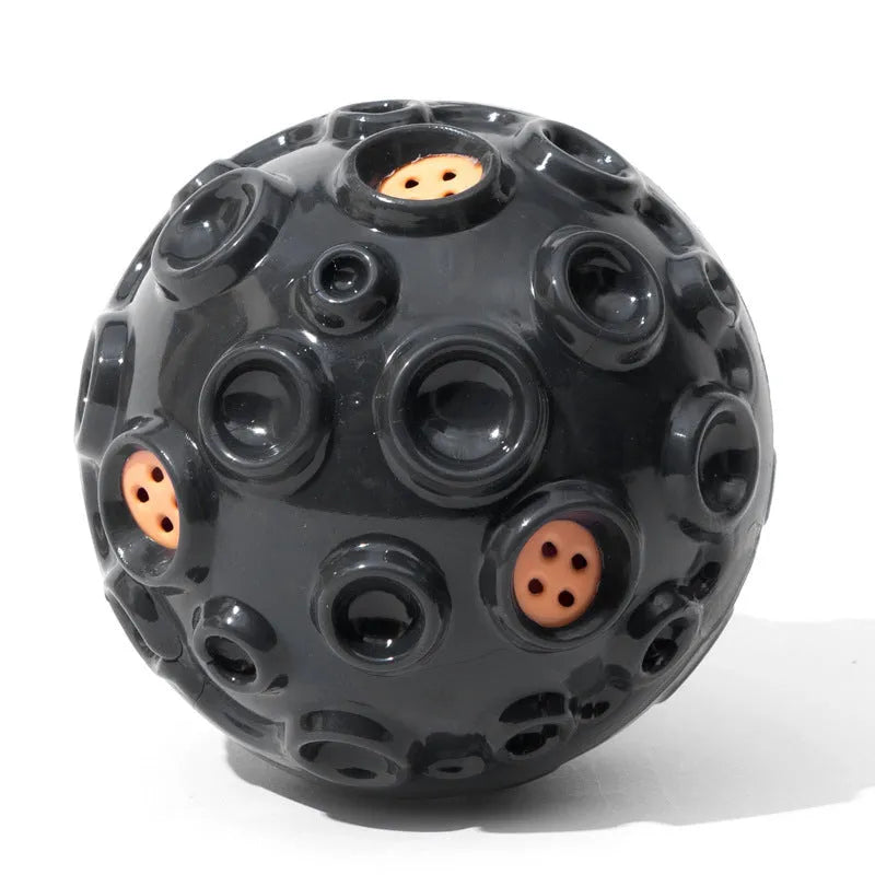 Durable natural rubber dog ball toy with textured surface and squeaker for aggressive chewers.