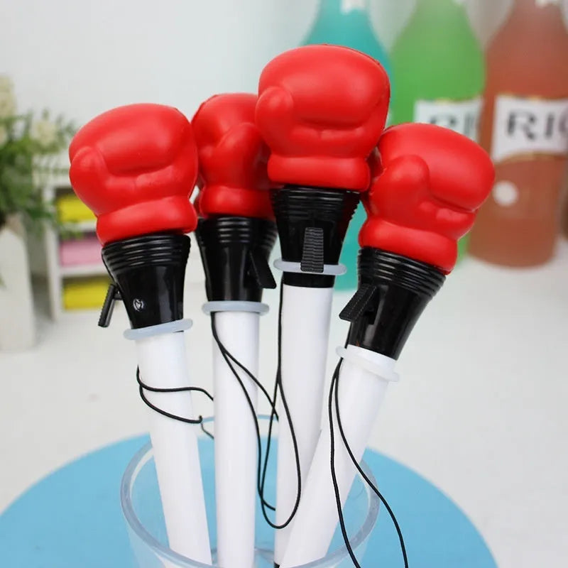 Four Creative Pressure Relief Boxing Press Ejection Pens with plug-in sleeves and black ink refills.