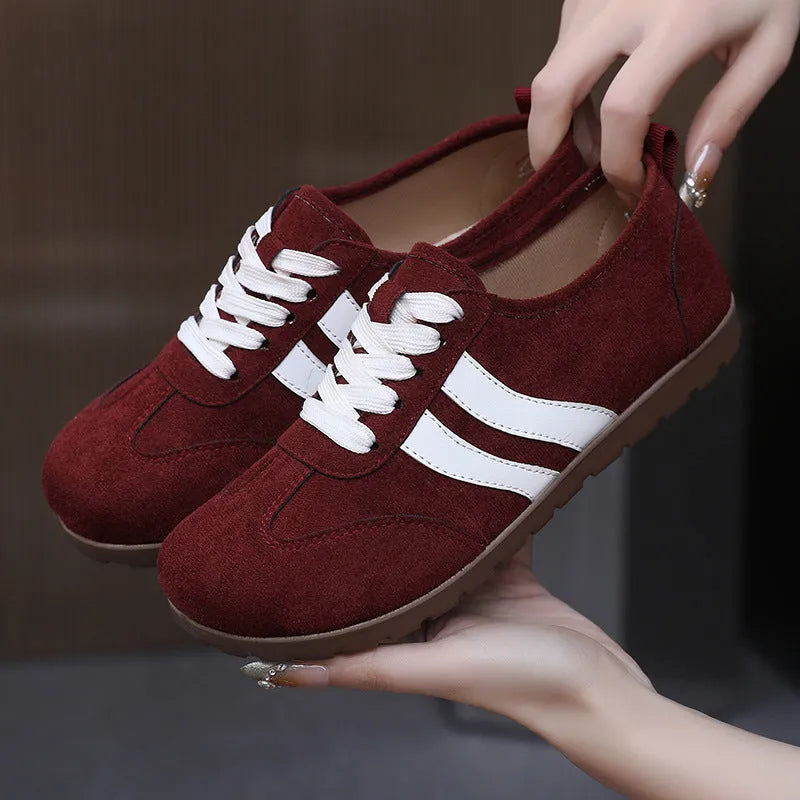 Women's vintage-style canvas sneakers with round toe and flat rubber sole in dark red colour