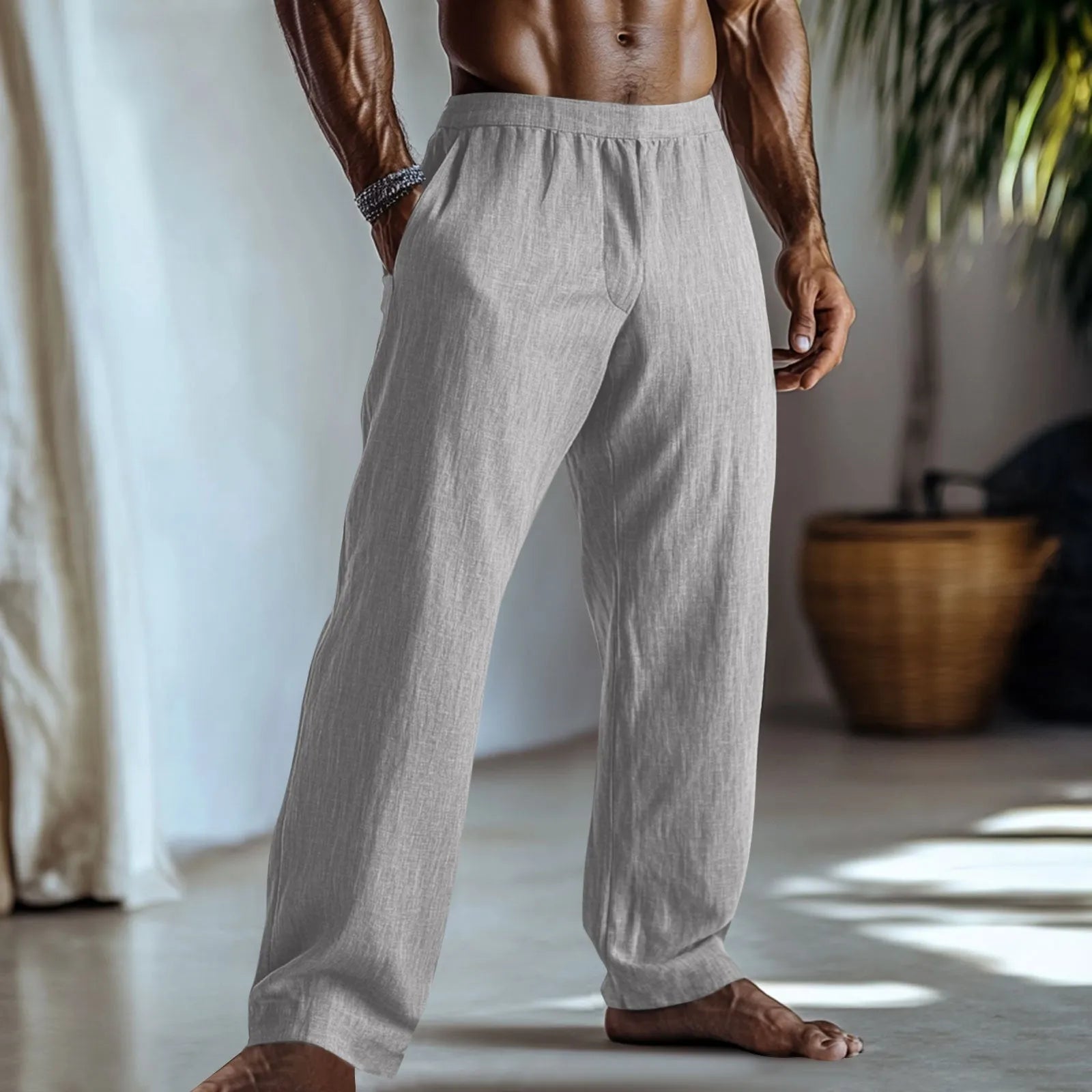 Straight-leg cotton and linen casual trousers in light green colour with visible pockets.