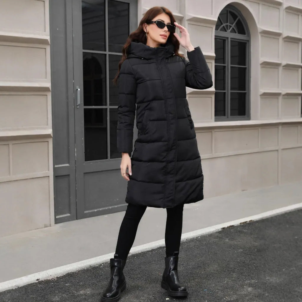 A black hooded slim-fit long jacket for men on a hanger.