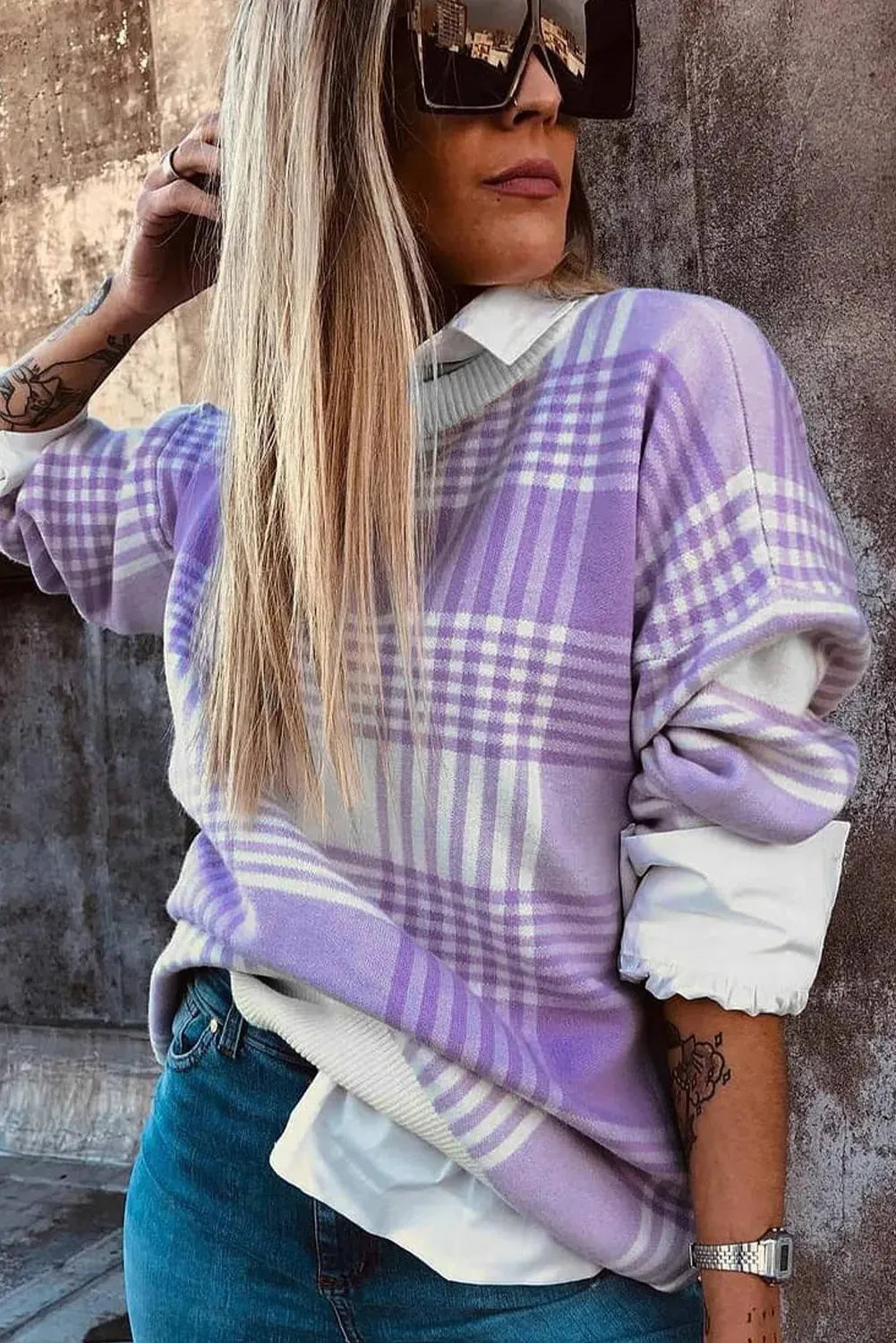 Lilac plaid print loose fit long sleeve sweater with ribbed trim on a hanger.