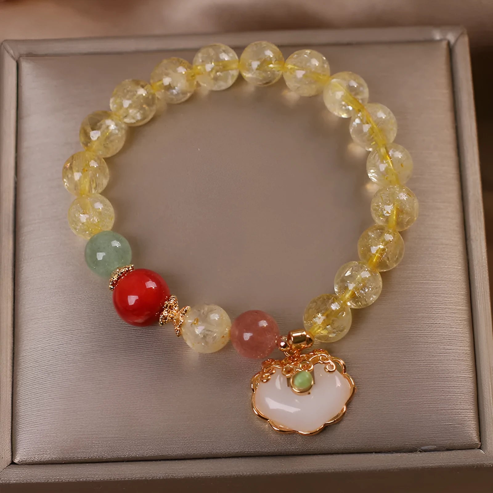 Original design women's alloy bracelet with a natural yellow hair crystal citrine jade ruyi pendant charm.