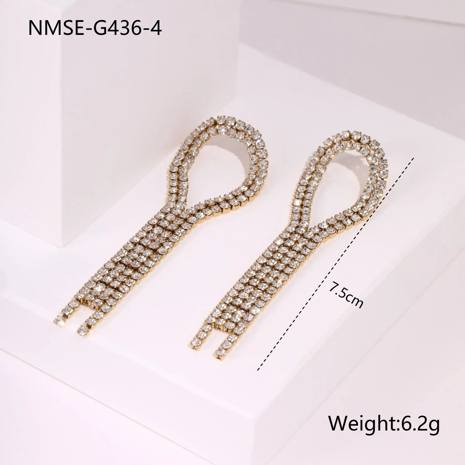 Gold electroplated stainless steel fashion earrings with heart, star, and geometric tassel design.