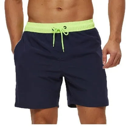 Men's blue drawstring athletic shorts with a zipper pocket and stitching detail on the waistband