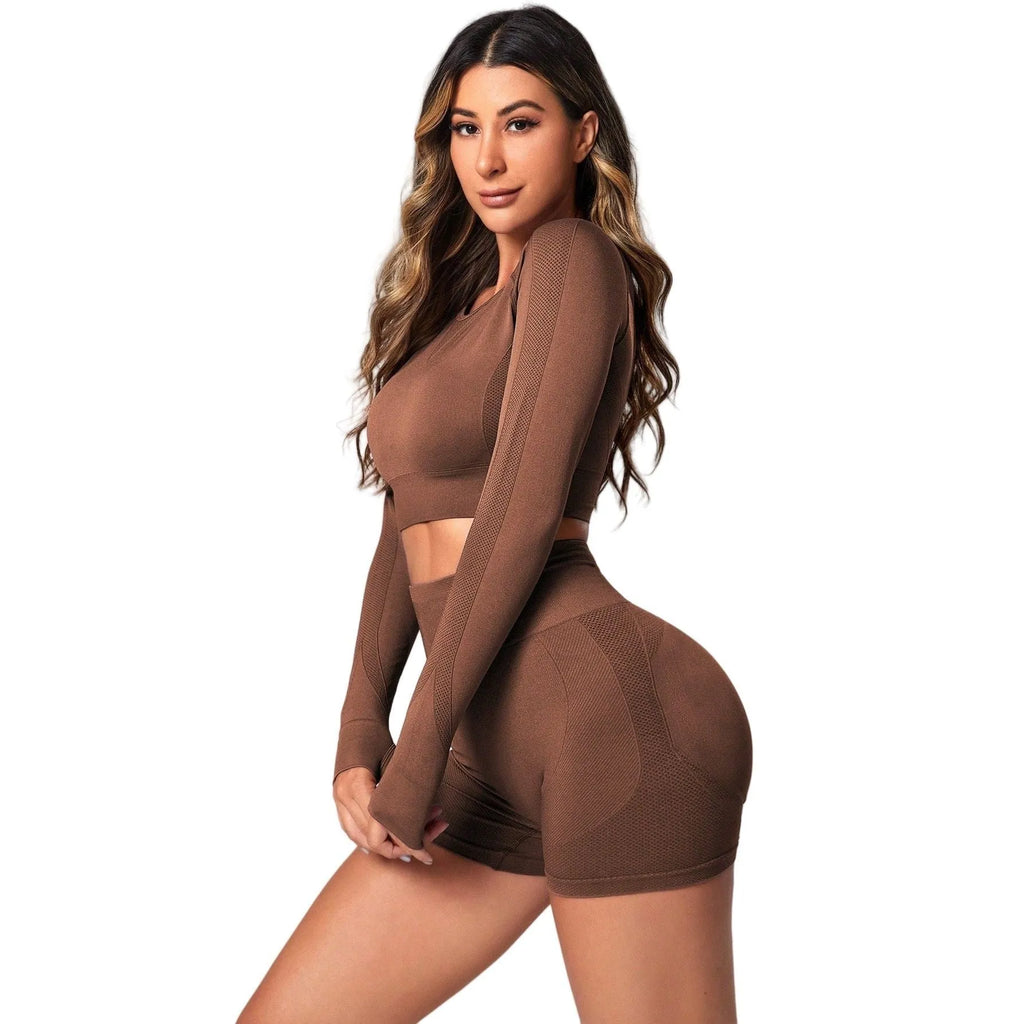 Women's high-waist yoga suit in black, featuring a long sleeve top and tight-fit trousers.