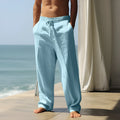 Men's cotton casual trousers with elastic waistband in seven solid colours showing loose fit design
