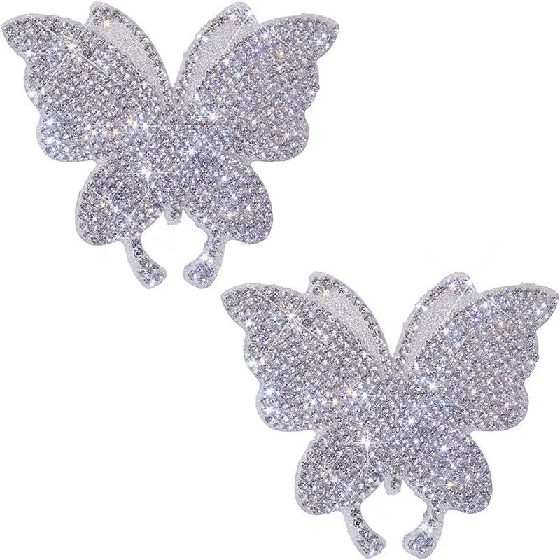 Close-up of a diamond-encrusted butterfly and bear claw design on a 7x6cm glass car sticker