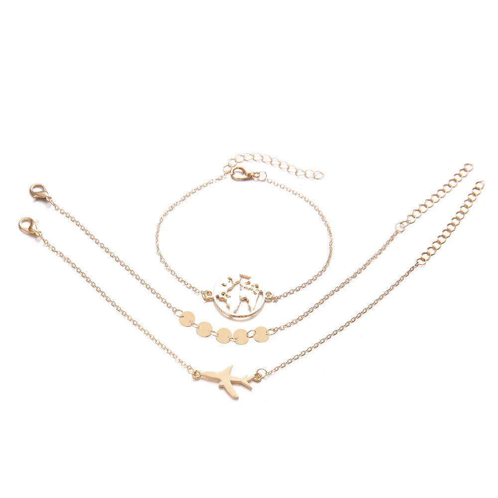 Three silver-tone alloy bracelets with heart-shaped charms featuring aircraft and map designs.