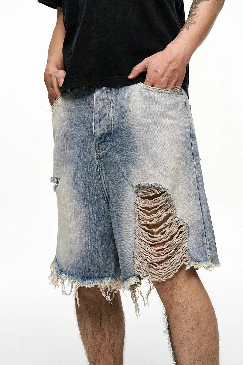 Light blue retro washed men's baggy denim shorts on a mid-waist model