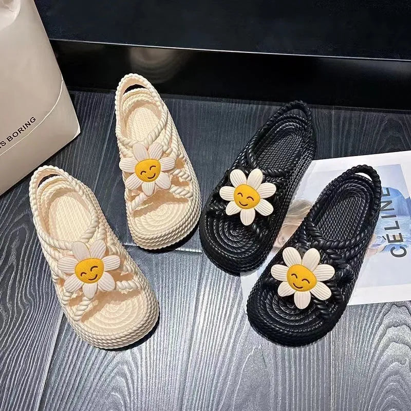 Women's beige PVC sandals with sunflower design, round toe and non-slip sole.