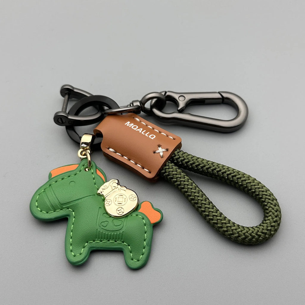 Handmade brown cowhide car key pendant with green flanelle rope and a metal buckle.
