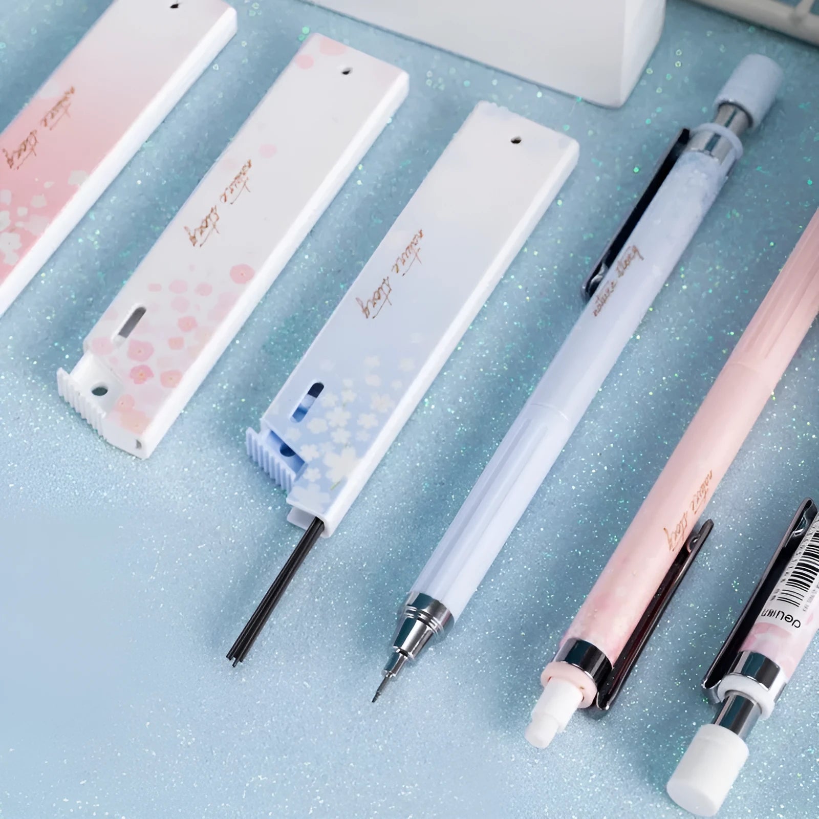 Sakura-themed automatic mechanical pencil set with three 0.5mm pencils and refill boxes