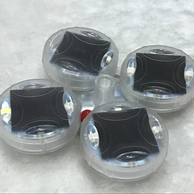 Colourful solar-powered LED valve light for mounting on vehicle wheel hubs.