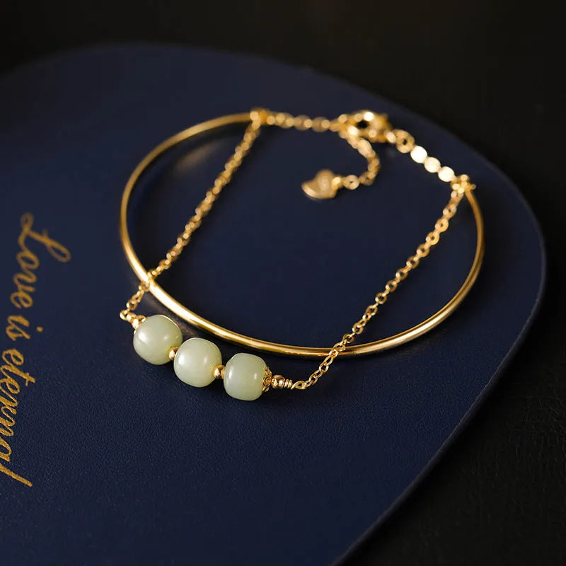 Women's jade bracelet with gold inlay detailing showing single, double and three bead versions