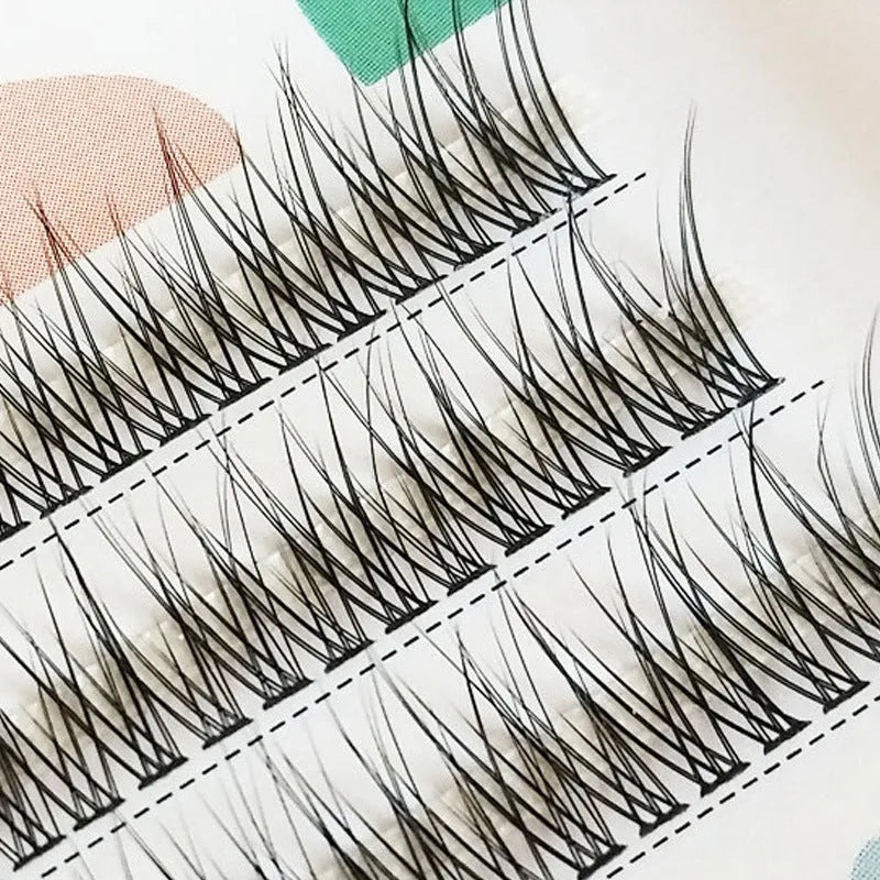 Black V-shaped fairy fishtail false eyelashes showing thick segment design in natural long style