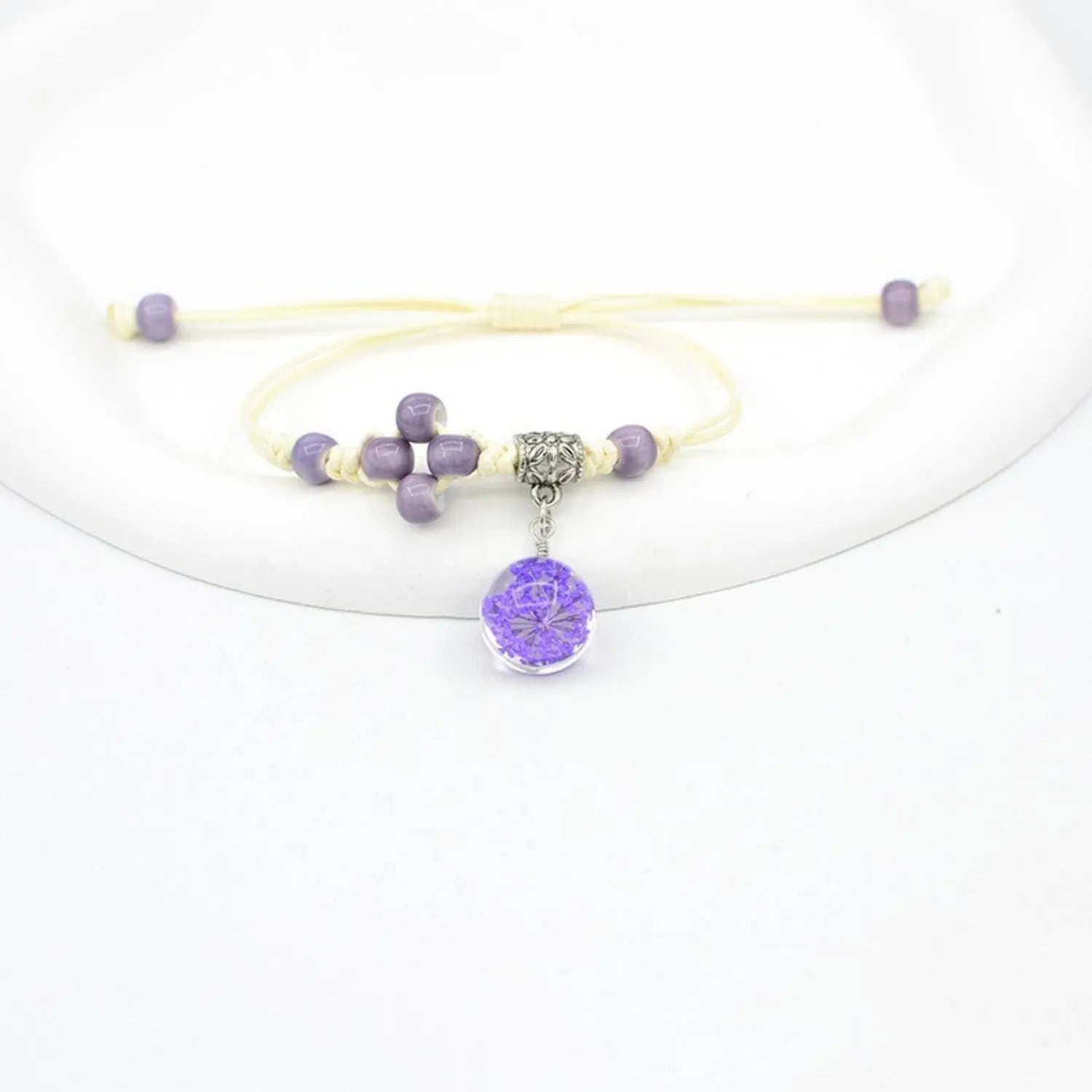 Glass dried flower bracelet with large 1.4cm beads containing real preserved flowers in hand-woven design