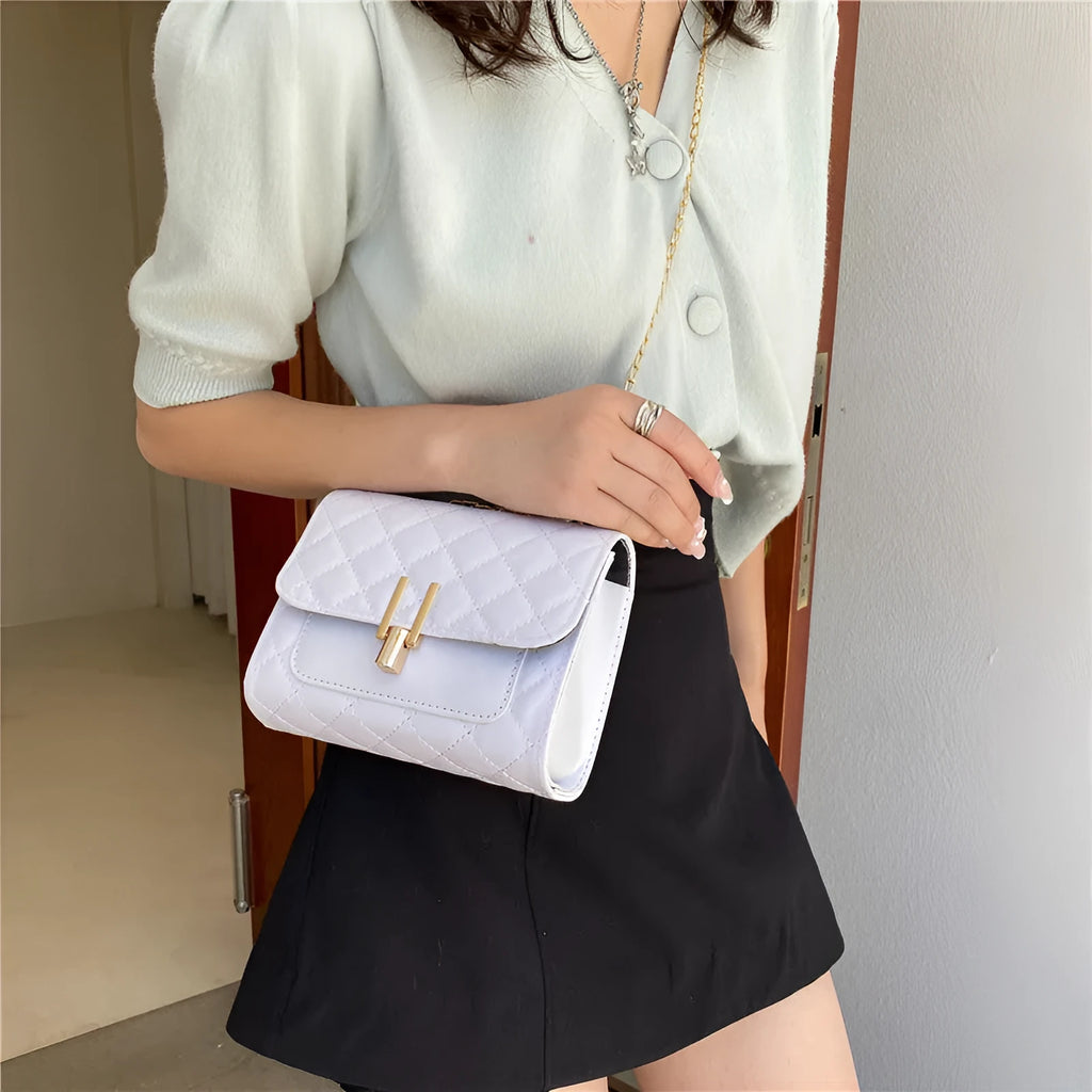 Women's black PU crossbody bag with a diamond lattice chain design on the front