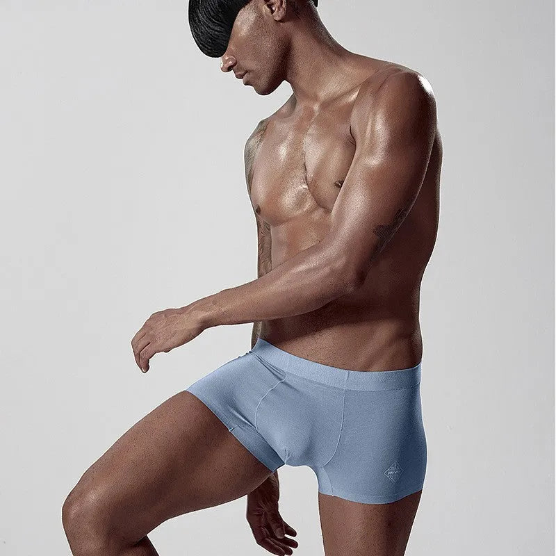 Men's modal seamless underwear in green colour showing mid waist design and solid pattern