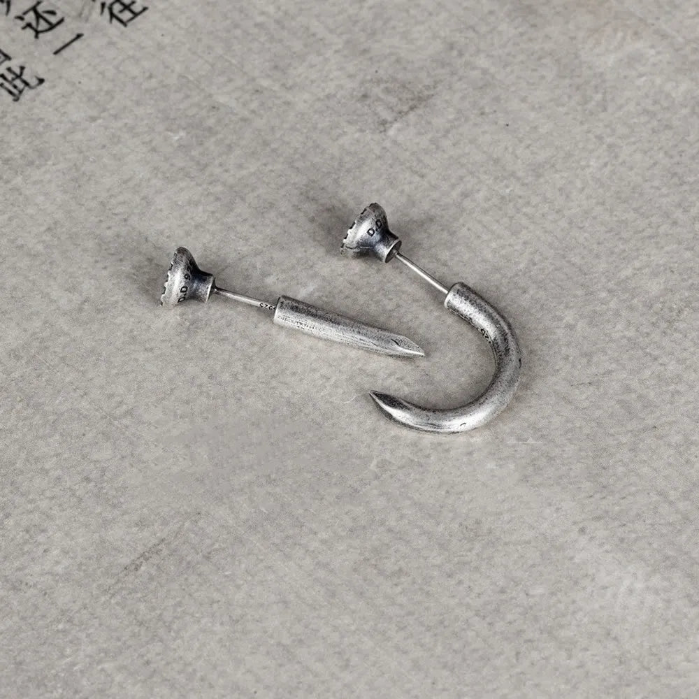 S925 sterling silver nail-shaped stud earrings on a plain background, showing straight and curved style options.