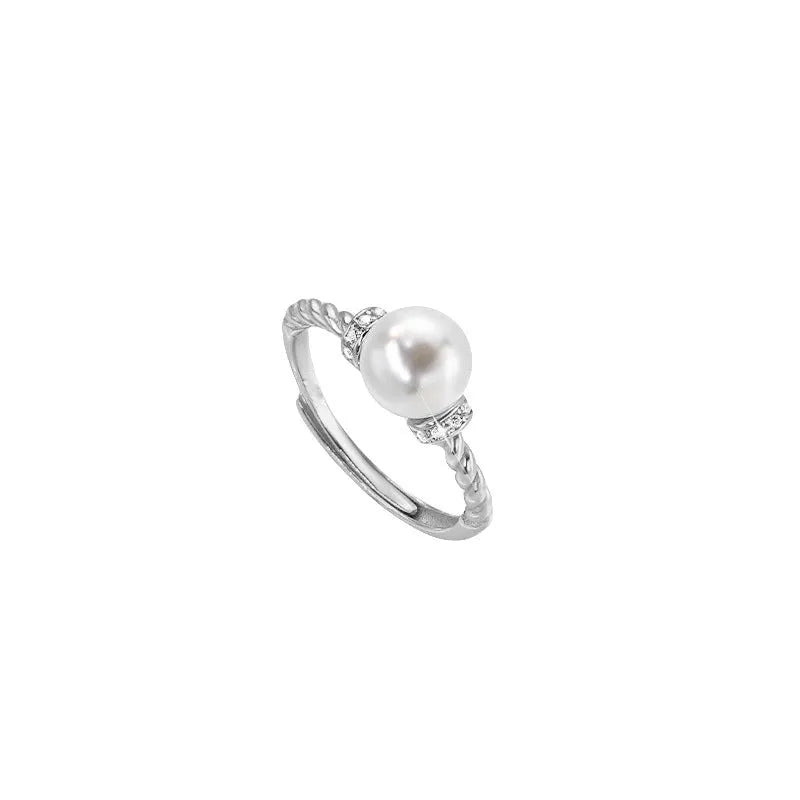 Adjustable copper ring with antique twist design and pearl inlay detail