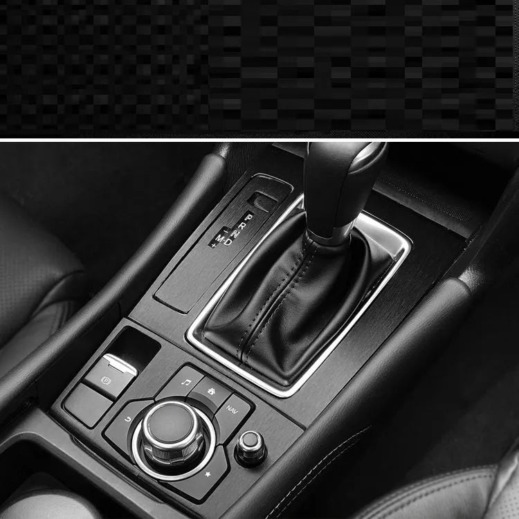 Car interior decorative vinyl sticker kit showing pre-cut pieces for dashboard, centre console and trim