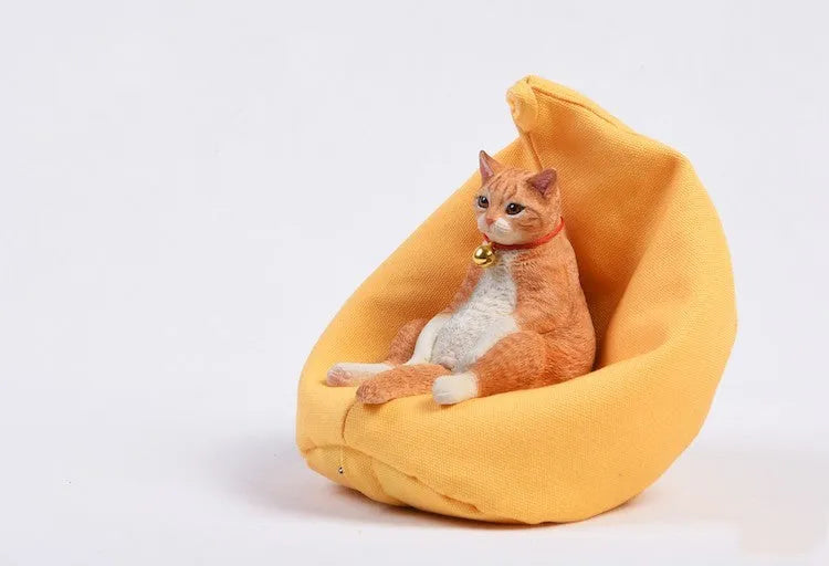 Lazy cat car ornament figure with sofa accessory on dashboard